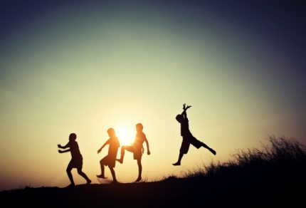 children-s-silhouettes-playing-at-sunset_1150-456